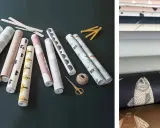 Rolki tapet winylowych z różnymi wzorami, nożyczki i sznurek. Idealne do nauki, jak kłaść tapetę winylową.