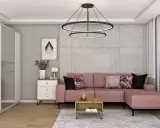 Różowa kanapa i kolorowe poduszki ocieplają szary salon. Wazon z kwiatami i stylowa lampka dodają przytulności.