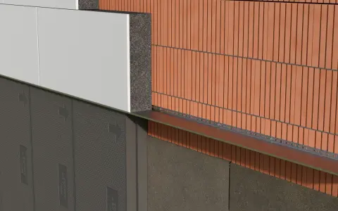 Warstwa styropianu przyklejona do ściany wewnętrznej, widoczny system ocieplenia z cegłą klinkierową i elementami montażowymi.