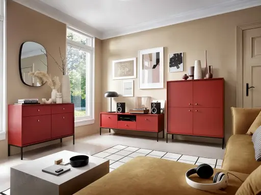 Nowoczesny salon z meblami w odcieniu burgundowym. Wygodna kanapa i stylowe komody tworzą przytulną atmosferę.