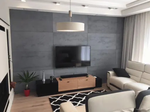 Nowoczesna ściana za telewizorem z betonowej płyty, idealna inspiracja co na sciane za telewizor.