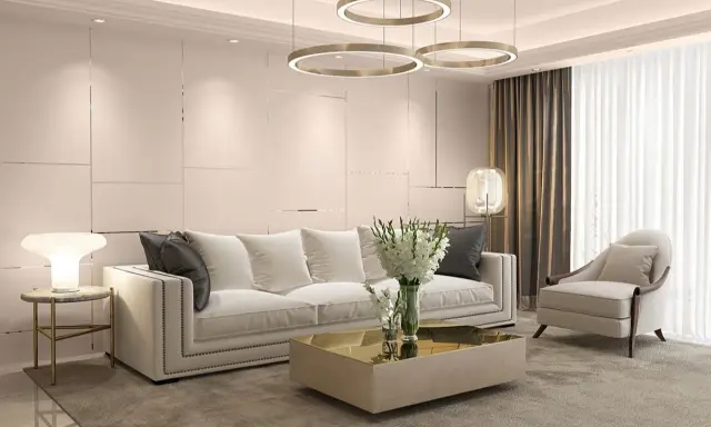 Elegancki art deco salon z białą sofą, złotym stolikiem kawowym i designerskimi lampami.