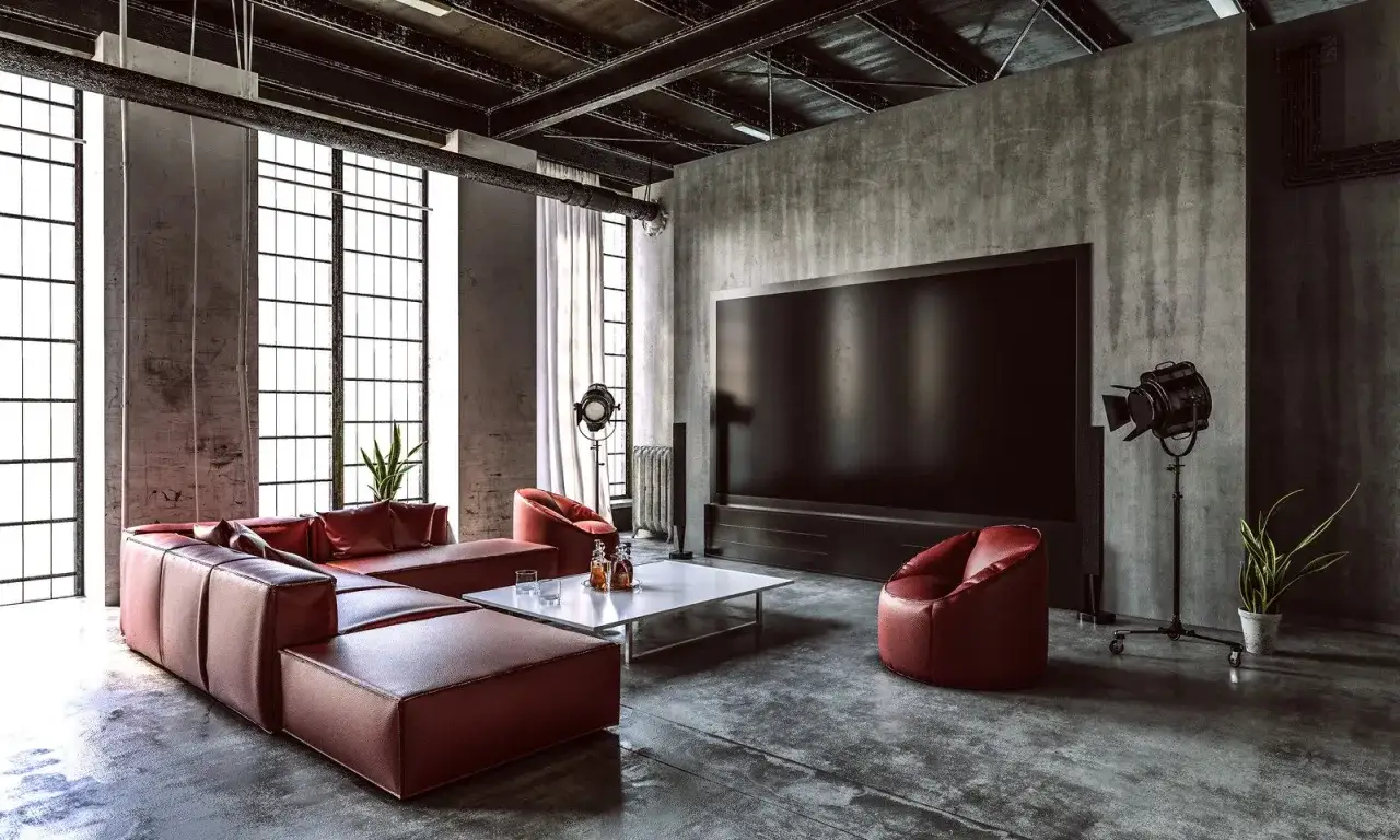 Nowoczesny salon z czerwoną kanapą i imitacją betonu na ścianach. Inspiracja, jak zrobić imitację betonu w industrialnym stylu.