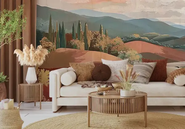 Urocza tapeta do sypialni z malowniczym krajobrazem wzgórz i cyprysów. Jasna sofa z poduszkami tworzy przytulną atmosferę.